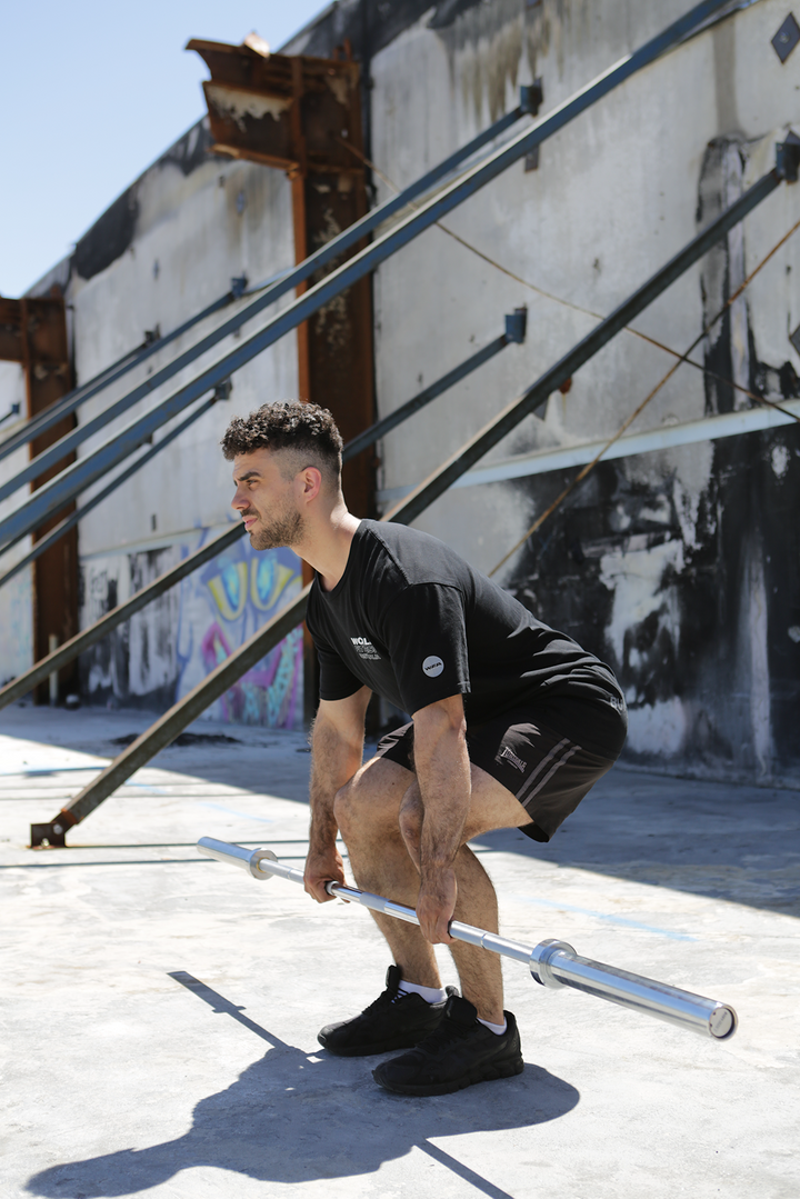 man doing barbell RDL 