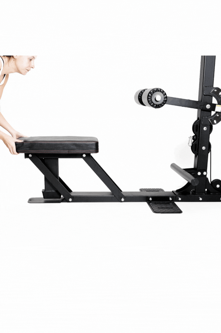 Female adjusting seat on lat pull down machine