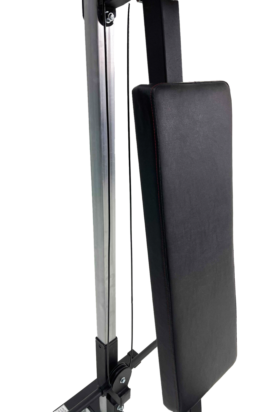 Black padded back rest on exercise machine